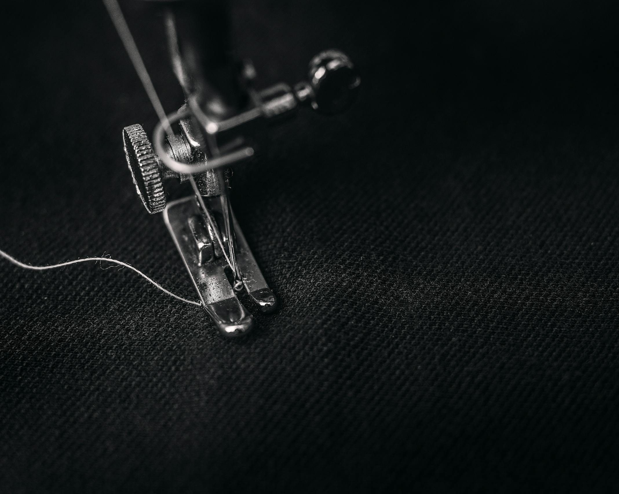 Closeup Photography of Presser Foot of Sewing Machine